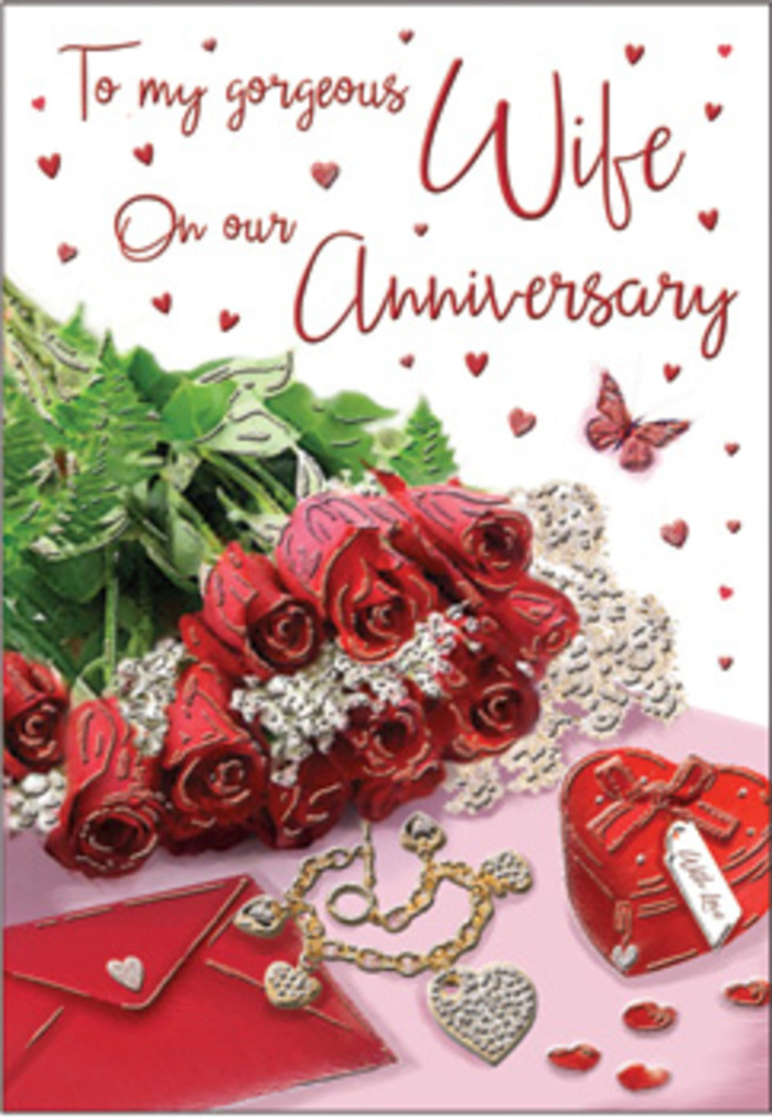 The photograph portrays a romantic anniversary setting styled with a florist's attention to detail, evoking the quiet intimacy of a West Ham living room after an evening walk near West Ham Park. At the centre sits a charming cluster of red roses, their petals plush and velvety, gathering into full, rounded blooms that speak of passion and tenderness. The reds are rich and saturated, gently highlighted along the petal edges, while deep shadows collect in the folds, giving the roses depth and dimension. They are ringed by fresh, green foliage, with leaves that shine softly under the light, bringing a sense of garden freshness into the composition. Nearby, a cream-coloured envelope lies partially open, its smooth surface and crisp folds suggesting a carefully written anniversary message tucked inside. A fine piece of jewellery, perhaps a delicate chain with a small charm, loops gracefully across the tabletop, its metallic gleam echoing the sentiment of a thoughtful gift chosen with care. A glossy heart-shaped box, rendered in bold red, nestles close to the roses, hinting at treasured keepsakes or perhaps a ring or locket resting inside. Around these central elements, tiny heart confetti and small sparkling accents are scattered, catching the light and adding a festive shimmer. A single butterfly motif appears to hover, wings outstretched, contributing an air of gentle fantasy and hope. Soft, warm lighting bathes the entire scene, accentuating textures of paper, petals, metal, and ribbon, and casting delicate shadows that make the arrangement feel tangible and real. The overall impression is one of enduring affection and thoughtful celebration, perfectly suited for marking a meaningful anniversary in West Ham.